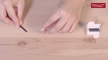 Insert and remove wax filter in custom hearing aids