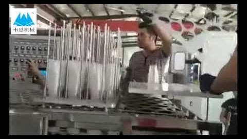 Robot stacker for disposable cup thermoforming machine