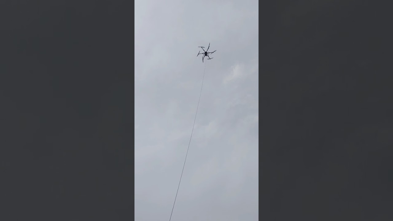 TETHERED DRONE EQUIP WITH 6KW TETHER POWER STATION AND OPTIC FIBER 