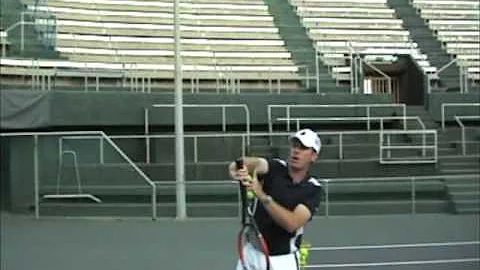 McCraw explaining a serve pronation exercise