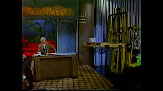 Johnny Carson drops a fruit cake on his desk - 12-20-85