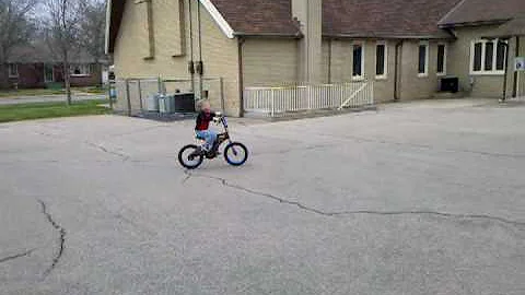 josh rides his bike by himself