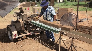 Making compressed earth blocks for barn build