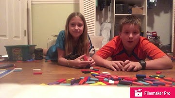 How to build a 2D domino pyramid