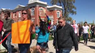 March for Science participants make their way through Downtown Logan on Saturday morning.