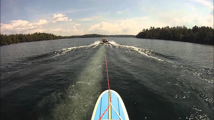 Paddleboarding behind boat trim