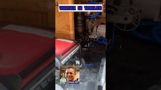 Vortex Lite carpet and upholstery cleaning machine set up in a trailer being pulled by a truck.