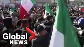 Residents in the border city of Tijuana, Mexico protested Sunday ag...