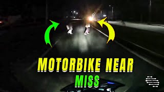 Motorbiker Barely Avoids Pedestrians in Darkness