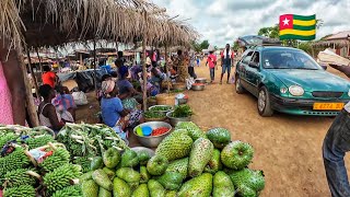 Rural market day in Assahoun village . Cheapest mass food market in Togo west Africa 🌍