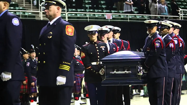 Firefighter Dennis Rodeman's casket is carried out at end of emotional service