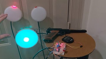 LASER 2 gun practice simulator target using a clamp on work light