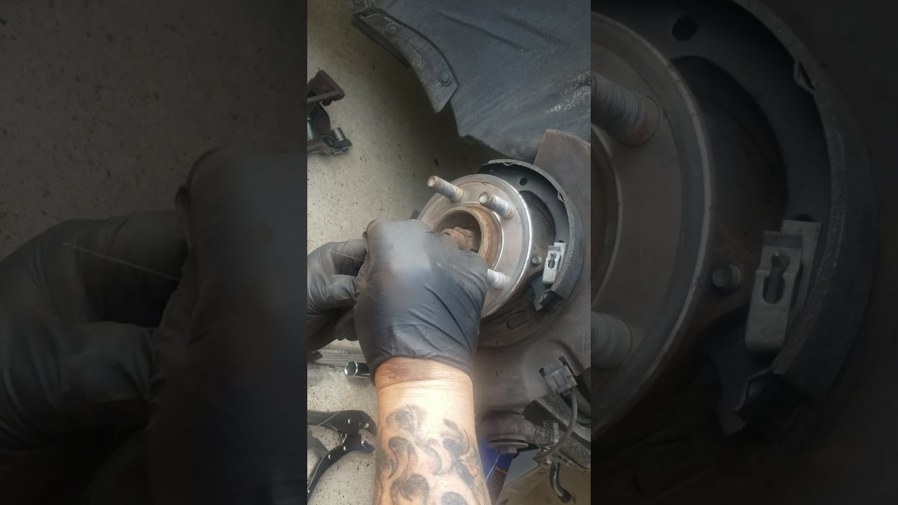 changing parking brake pads on a chrysler 300 rear axle - YouTube