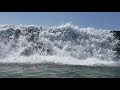 Surf hitting the breakwall