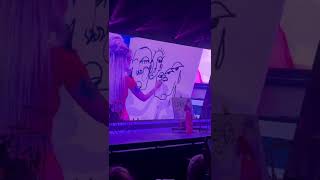 Halsey paints while performing Be Kind