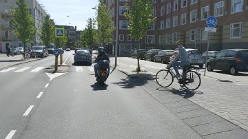 First test ride VanMoof S3 in Amsterdam behind a Felyx NIU