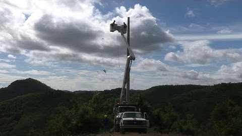 Pole to pole, linemen work to restoring power in Puerto Rico