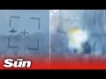 Ukrainian forces cheer as they destroy Russian helicopter with anti-tank guided missile in Kharkiv