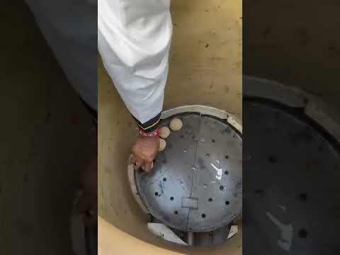 Looking into a PURI gas tandoor at the burner and baffle plate