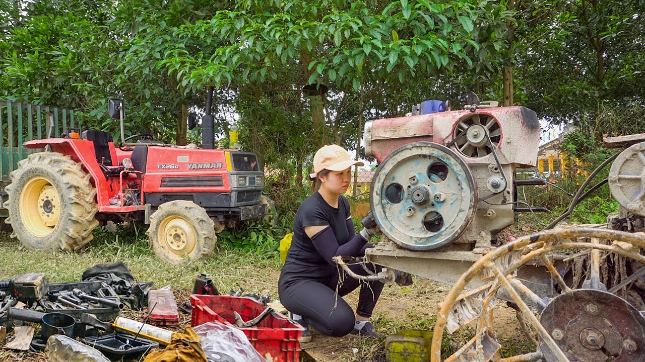 The Girl Repairing a Broken Tractor Stuck In Muddy Field For a Farmer - Girl Mechanical