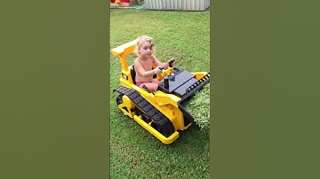 Aussie Dad buys daughter a Bulldozer so she can help with the lawn