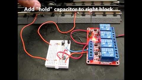 Insulated rail relay triggering with anti chatter hold delay