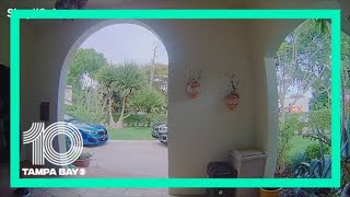 FedEx worker sanitizes package before delivering it