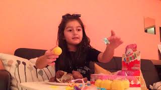 Natalie Aramov opens kinder eggs