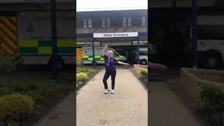 Keyworker taps for charity outside hospital