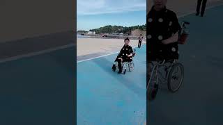 Carol quad amputee in her wheelchair near the beach