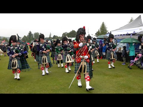 Drum Major leads Ballater Pipe Band march in starting displays during 2023 Aboyne Highland Games