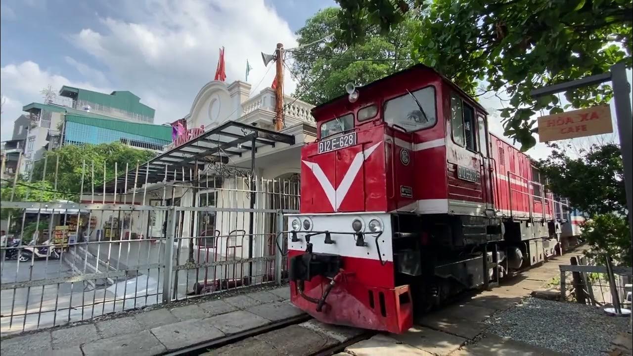 The train leaving station at Hanoi Train Track Cafe YouTube