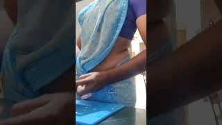 Hot housewife in saree working in kitchen  | hip and navel seen
