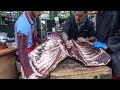 Cutting to Pieces a Quarter of a Cow ! Butcher in London Bridge Market. Street Food