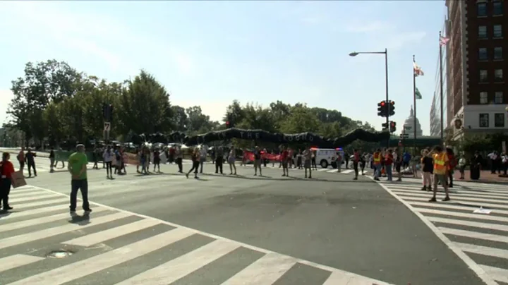 Climate change protesters block traffic at major intersections through out D.C.