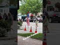 Stilt walker crossing the street shorts stiltwalker