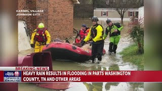 Family with pets rescued by boat in Carmel Village in Johnson City