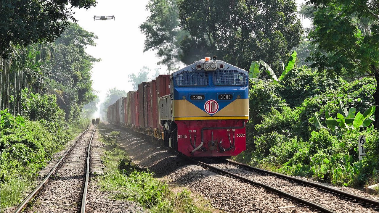 Container Transport Train / BFCT Train passing besides hills of ...
