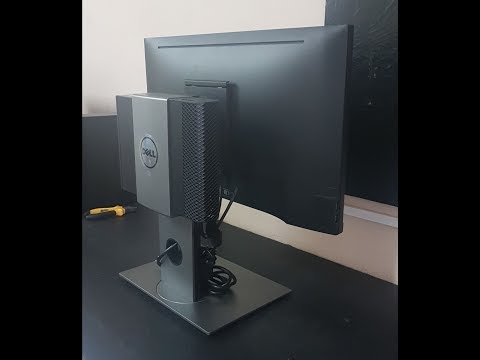 Vídeo: Como você monta um monitor Dell em um suporte?