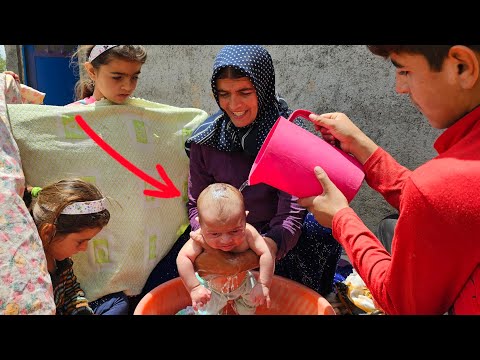 Bathing in the open air; Akram bathes her children with love