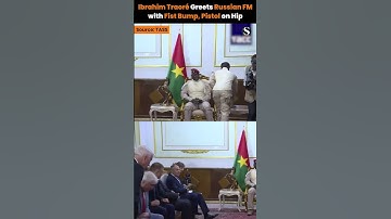 He FIST BUMPS Russian Officials with a PISTOL on His Hip: Burkina Faso