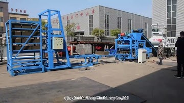 Block machine with automatic frame stacking system