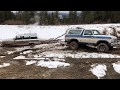 1978 Ford Bronco pulling out a 1988 Jeep Grand Wagoneer.