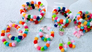 Pulseiras de mola com pompom