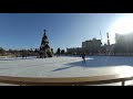 Зимний каток Roshen Winter Village в парке Рошен-Плаза днём и вечером