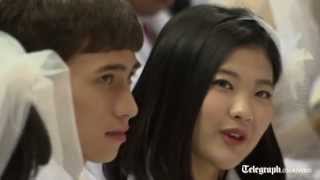 Thousands of Moonies marry in mass wedding