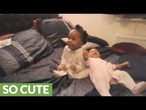 Watch These Twin Babies Dance To Their Mom's Singing!