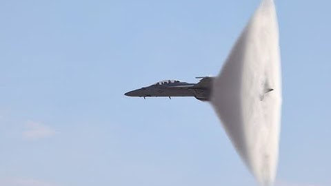 Navy F/A-18 Breaking The Sound Barrier Over Water
