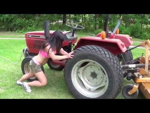 Almost 50 year old Farm Girl Pulls Tractor and pushes it! International 244.
