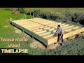 Construction of a wooden frame house far from the city  timelapse